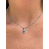 18K White Gold Tanzanite Drop Pendant With Diamond Halo