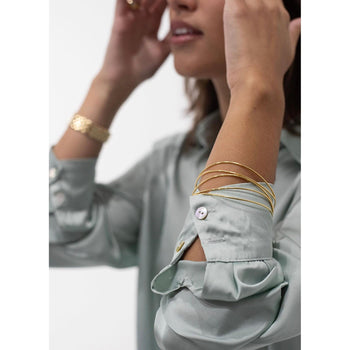 Elsa Peretti pour Tiffany & Co. Bracelet rigide et boucles d'oreilles pendantes en or 18 carats – Assay Jewelers