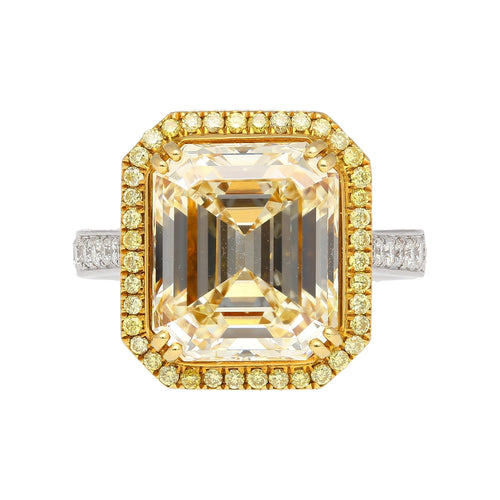 Emerald Cut Natural 7.25 Carat Fancy Light Yellow Diamond with Round Diamond Halo Ring